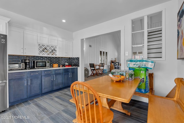 dining room with a toaster and recessed lighting