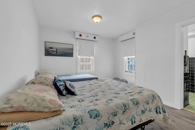 bedroom featuring wood finished floors