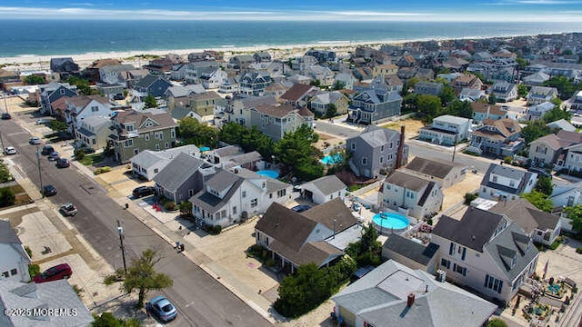 birds eye view of property featuring a residential view and a water view
