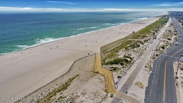 drone / aerial view with a view of the beach and a water view