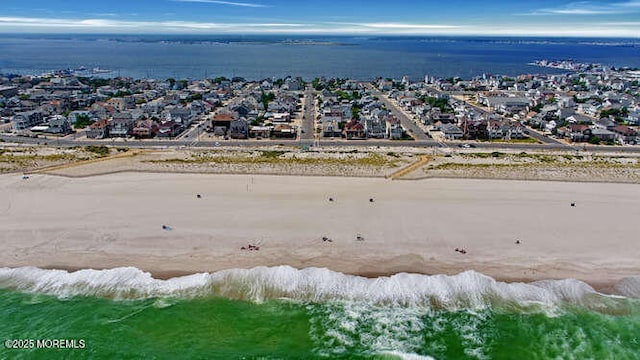 drone / aerial view with a residential view and a water view