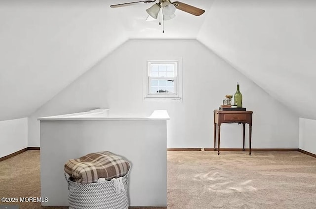 bonus room with carpet flooring, a ceiling fan, baseboards, and vaulted ceiling