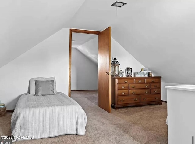 bedroom with baseboards, carpet, and vaulted ceiling