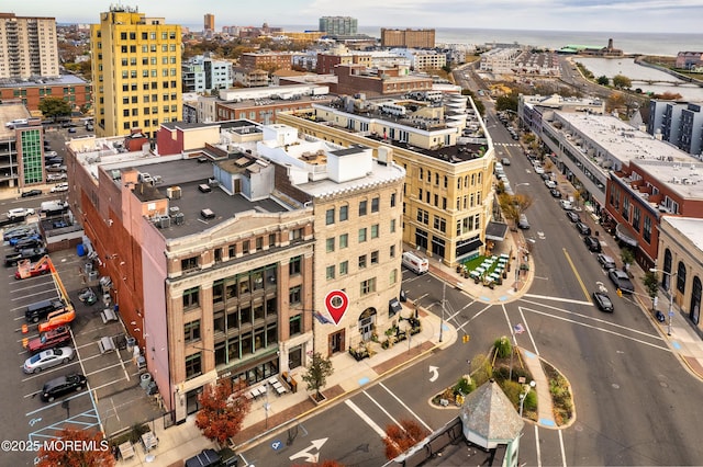aerial view featuring a city view and a water view