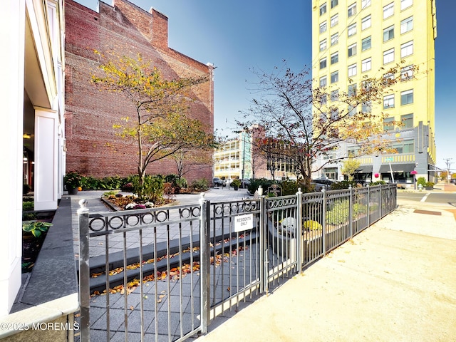 view of community with fence