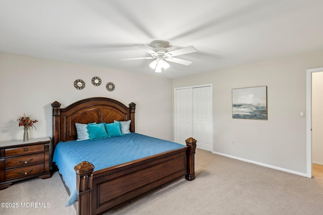 bedroom featuring a closet, baseboards, ceiling fan, and light colored carpet