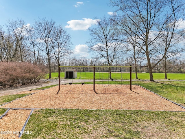 view of home's community featuring a yard and playground community