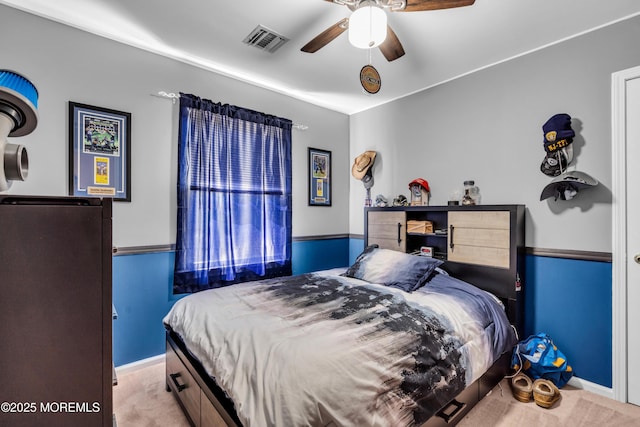 bedroom featuring visible vents, baseboards, a ceiling fan, and carpet