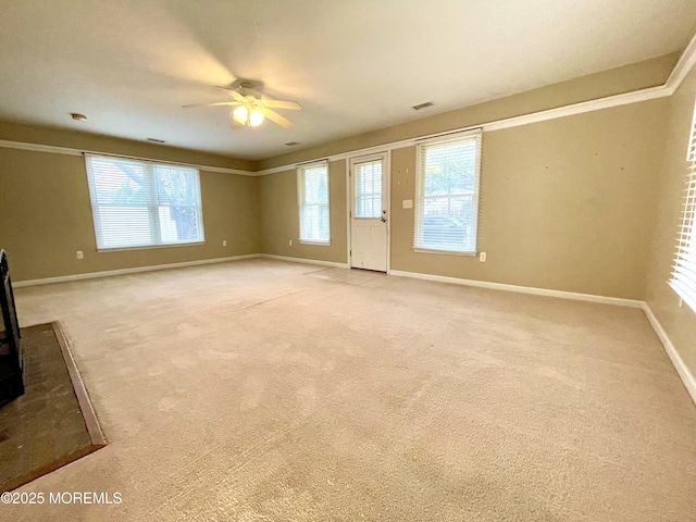 5 Laurel Ave, Toms River, NJ 08753 - unfurnished living room featuring visible vents, baseboards, a ceiling fan, and light colored carpet