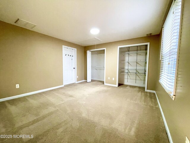 5 Laurel Ave, Toms River, NJ 08753 - unfurnished bedroom featuring baseboards, two closets, attic access, multiple windows, and carpet