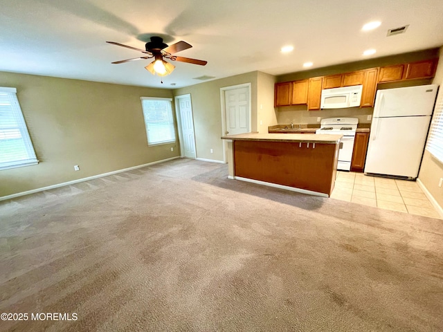 5 Laurel Ave, Toms River, NJ 08753 - kitchen featuring visible vents, baseboards, white appliances, a kitchen island, and light colored carpet