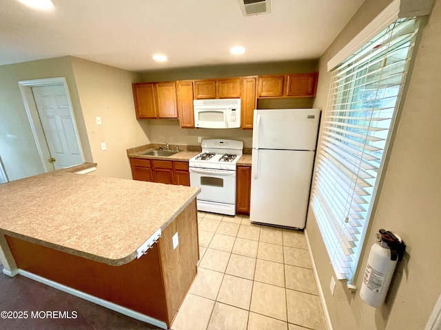 5 Laurel Ave, Toms River, NJ 08753 - kitchen with visible vents, light tile patterned floors, a sink, light countertops, and white appliances
