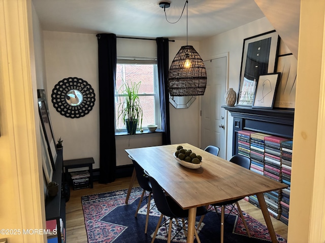 dining area with wood finished floors and baseboards