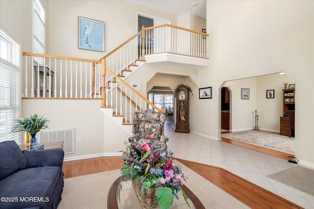 1306 Wickford Ln, Lanoka Harbor, NJ 08734 - living area featuring plenty of natural light, arched walkways, visible vents, and a high ceiling