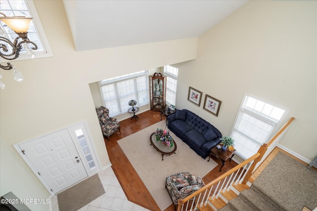 1306 Wickford Ln, Lanoka Harbor, NJ 08734 - living area featuring high vaulted ceiling, an inviting chandelier, and a healthy amount of sunlight