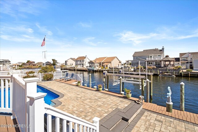 1306 Wickford Ln, Lanoka Harbor, NJ 08734 - view of dock featuring a water view, a residential view, boat lift, and a patio area