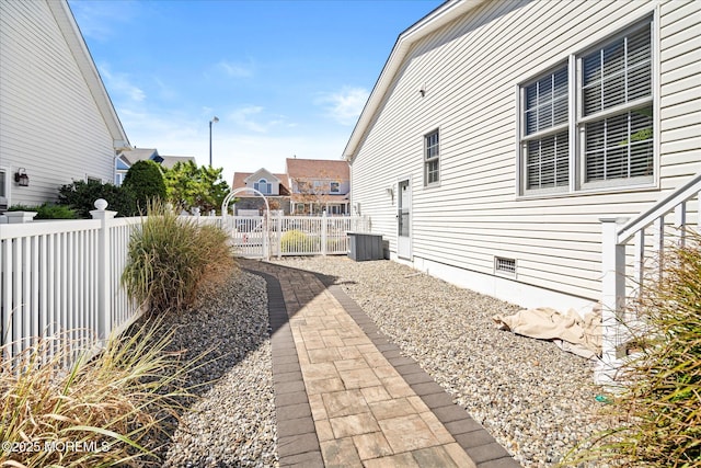 1306 Wickford Ln, Lanoka Harbor, NJ 08734 - view of side of property with central AC unit, crawl space, and fence