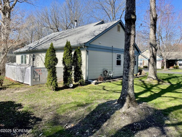 28 Morning Glory Ln, Whiting, NJ 08759 - view of side of property featuring roof with shingles and a yard