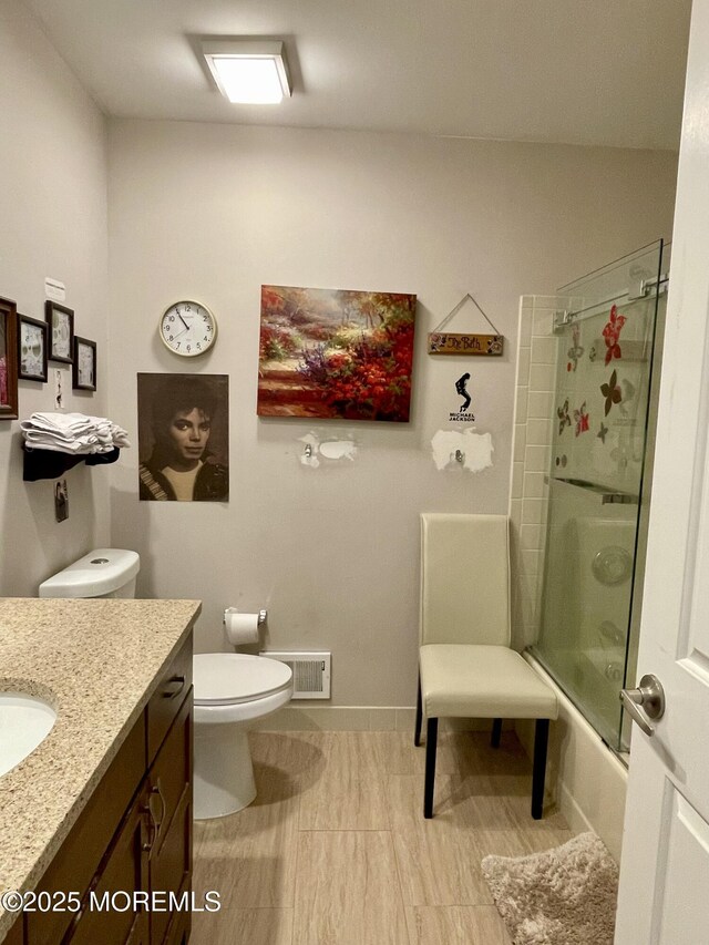 28 Morning Glory Ln, Whiting, NJ 08759 - bathroom with visible vents, toilet, enclosed tub / shower combo, vanity, and tile patterned flooring