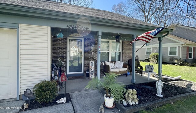 28 Morning Glory Ln, Whiting, NJ 08759 - entrance to property featuring a yard, covered porch, and brick siding