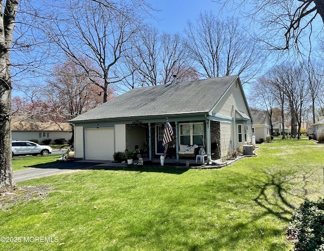 28 Morning Glory Ln, Whiting, NJ 08759 - view of front facade featuring a front yard, a porch, an attached garage, aphalt driveway, and roof with shingles