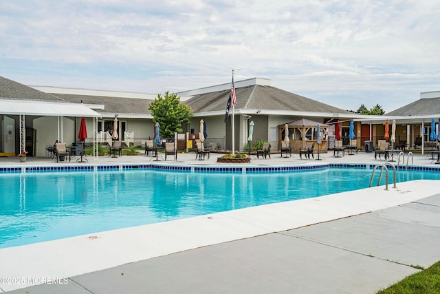 community pool with a patio area