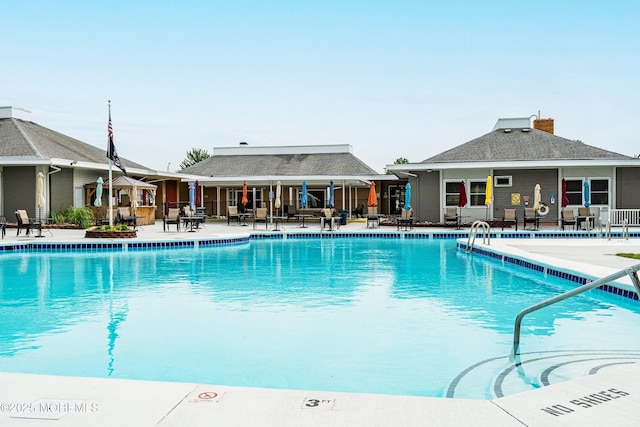community pool with a patio area