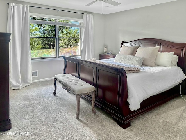bedroom featuring ceiling fan, baseboards, visible vents, and carpet floors
