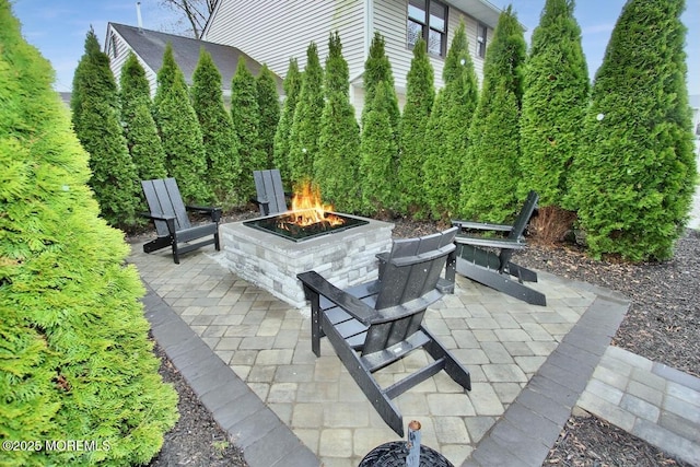view of patio / terrace featuring a fire pit