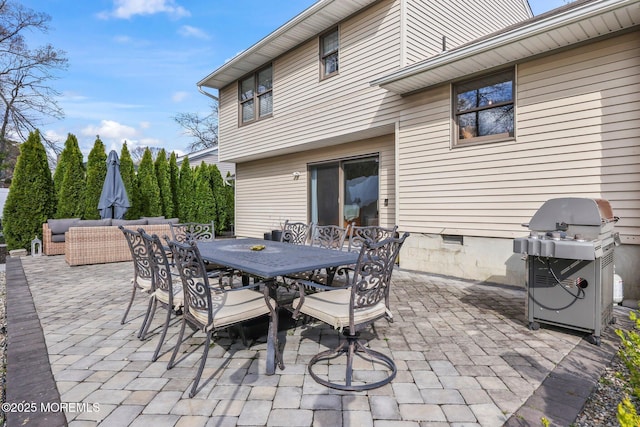 view of patio / terrace with outdoor dining space, a grill, and an outdoor living space