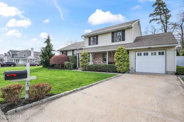 view of front of house featuring concrete driveway, a front lawn, brick siding, and a garage