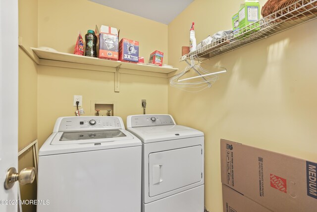 clothes washing area with laundry area and washing machine and clothes dryer