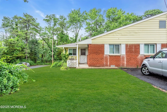 4 Flamingo Ter Unit A, Manchester, NJ 08759 - view of front of property with brick siding and a front yard
