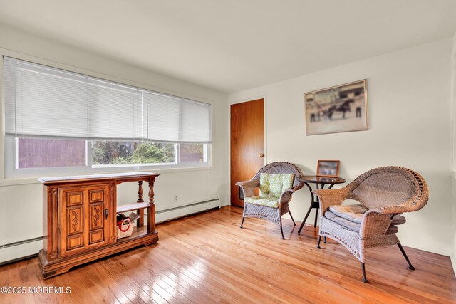 4 Flamingo Ter Unit A, Manchester, NJ 08759 - living area with a baseboard radiator and light wood-type flooring