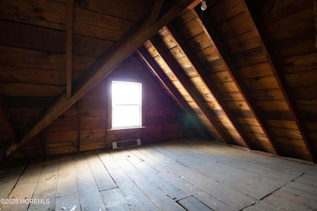 unfinished attic featuring visible vents