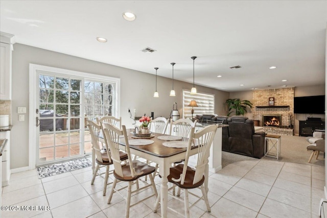 dining space featuring visible vents, recessed lighting, light tile patterned floors, and a healthy amount of sunlight
