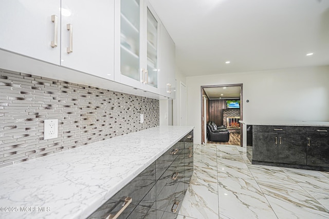 56 Dutch Rd, East Brunswick, NJ 08816 - kitchen featuring glass insert cabinets, white cabinets, recessed lighting, decorative backsplash, and marble finish floor