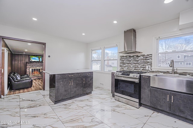 56 Dutch Rd, East Brunswick, NJ 08816 - kitchen featuring a brick fireplace, a sink, ventilation hood, recessed lighting, and gas stove