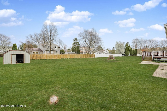 56 Dutch Rd, East Brunswick, NJ 08816 - view of yard with a deck, an outbuilding, and fence