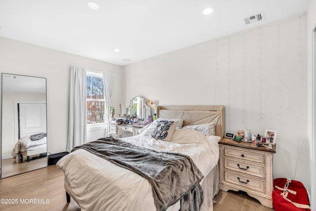 bedroom featuring recessed lighting, light wood-style flooring, and visible vents