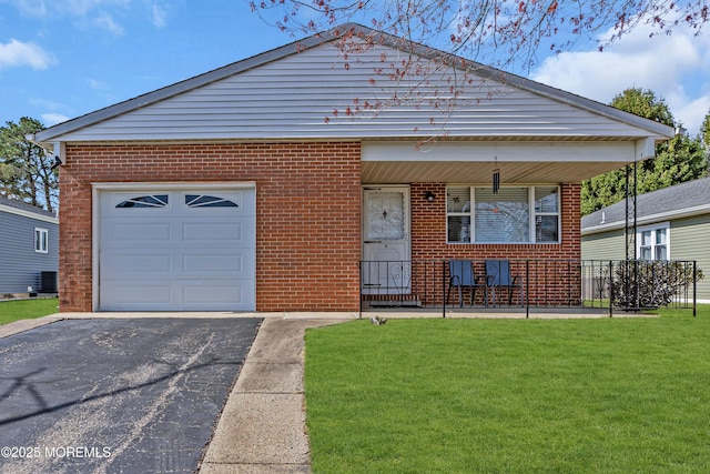 9 Banning Ct, Toms River, NJ 08757 - view of front of home with central air condition unit, a front yard, brick siding, a garage, and covered porch