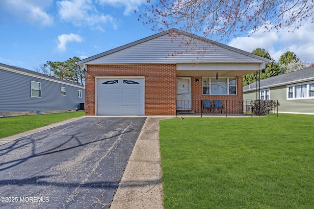 9 Banning Ct, Toms River, NJ 08757 - ranch-style house featuring driveway, a front yard, brick siding, a garage, and covered porch
