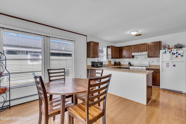 9 Banning Ct, Toms River, NJ 08757 - kitchen featuring tasteful backsplash, light countertops, white appliances, under cabinet range hood, and dark brown cabinets