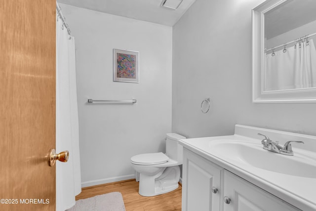 9 Banning Ct, Toms River, NJ 08757 - bathroom featuring toilet, vanity, wood finished floors, and baseboards