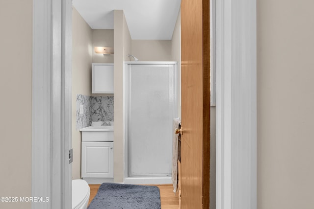 9 Banning Ct, Toms River, NJ 08757 - bathroom featuring toilet, a shower stall, vanity, and wood finished floors