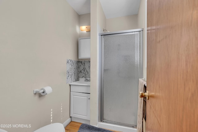 9 Banning Ct, Toms River, NJ 08757 - full bath featuring toilet, a stall shower, wood finished floors, and vanity