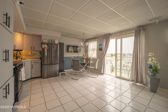 349 Harbor Vw, Forked River, NJ 08731 - kitchen with freestanding refrigerator, light countertops, light floors, decorative backsplash, and electric range