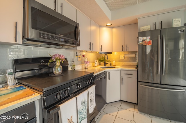 349 Harbor Vw, Forked River, NJ 08731 - kitchen with black appliances, light countertops, backsplash, and white cabinets