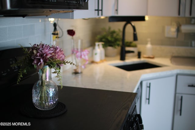 349 Harbor Vw, Forked River, NJ 08731 - kitchen featuring decorative backsplash, light countertops, and white cabinets
