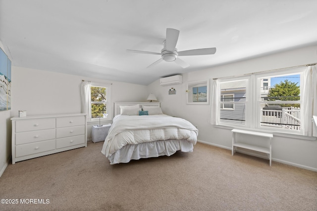 carpeted bedroom featuring baseboards, a ceiling fan, and a wall unit AC